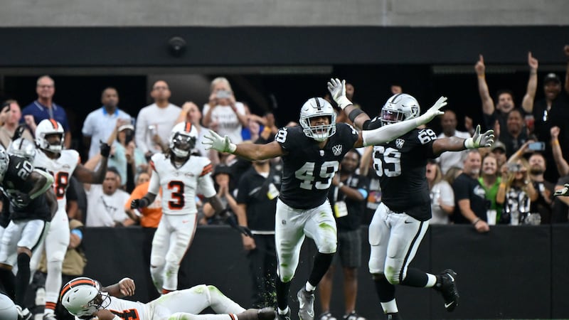 Las Vegas Raiders defensive end Charles Snowden, center, celebrates after sacking Cleveland...