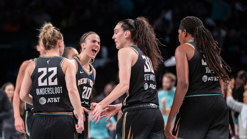 New York Liberty guard Sabrina Ionescu (20) celebrates with forward Breanna Stewart (30)...