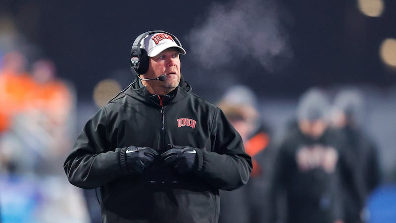 UNLV head coach Barry Odom looks on from the sideline during a timeout in the first half of...