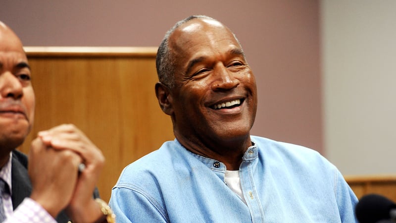 FILE - In this July 20, 2017, file photo, former NFL football star O.J. Simpson reacts after...