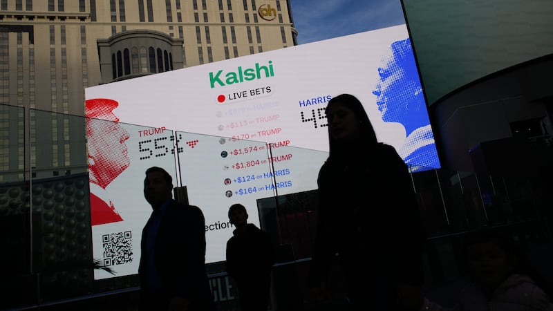 Betting odds on Presidential election results are displayed on screens along The Strip,...