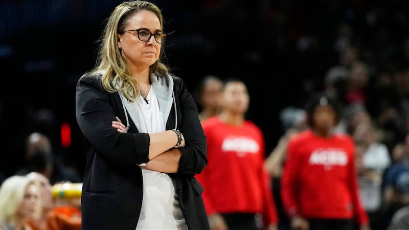 Las Vegas Aces head coach Becky Hammon watches during the second half in Game 1 of a WNBA...