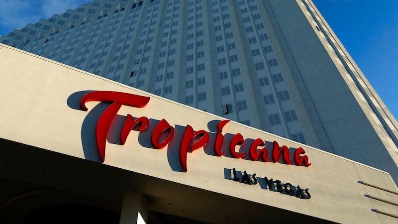 FILE - In this Aug. 4, 2015, file photo, sunlight illuminates a sign at the Tropicana hotel...