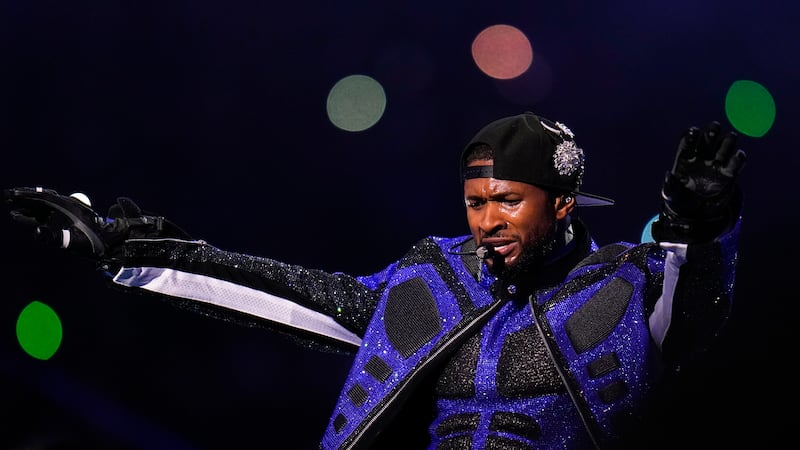 Usher performs during halftime of the NFL Super Bowl 58 football game between the San...