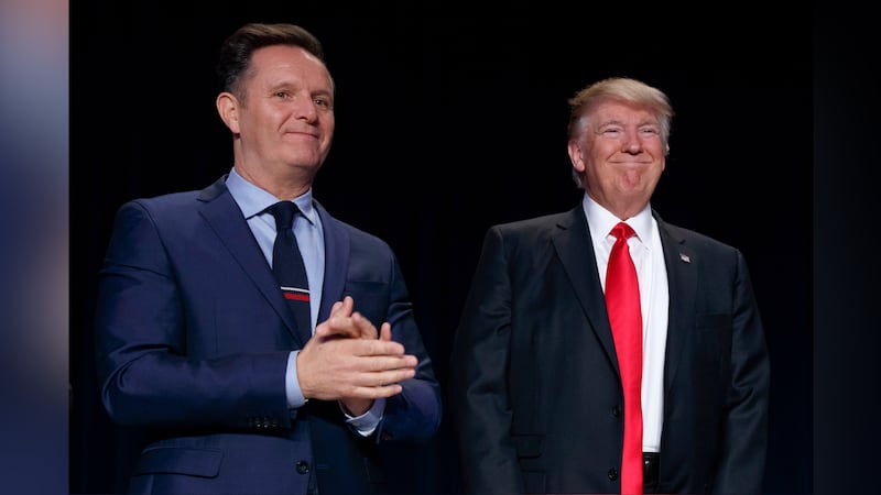 FILE - Television producer Mark Burnett, left, looks on as President Donald Trump arrives for...