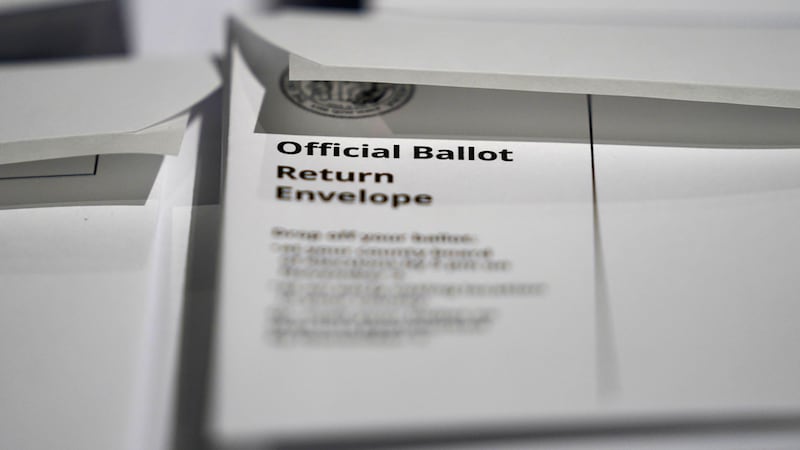 FILE - In this Sept. 3, 2020, file photo, stacks of ballot envelopes waiting to be mailed are...