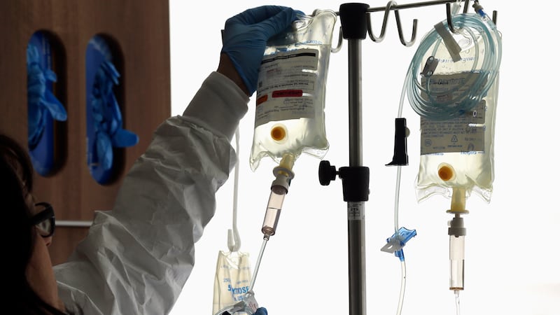 This file photo taken Aug. 27, 2013 shows a nurse preparing an IV bag at Duke Cancer Center in...