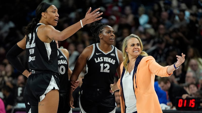 Las Vegas Aces head coach Becky Hammon, right, motions to her player during the second half of...