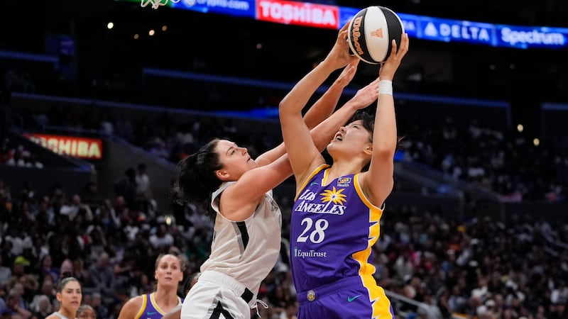 Los Angeles Sparks center Li Yueru (28) shoots against Las Vegas Aces center Megan Gustafson...