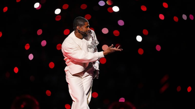 Usher performs during halftime of the NFL Super Bowl 58 football game between the San...