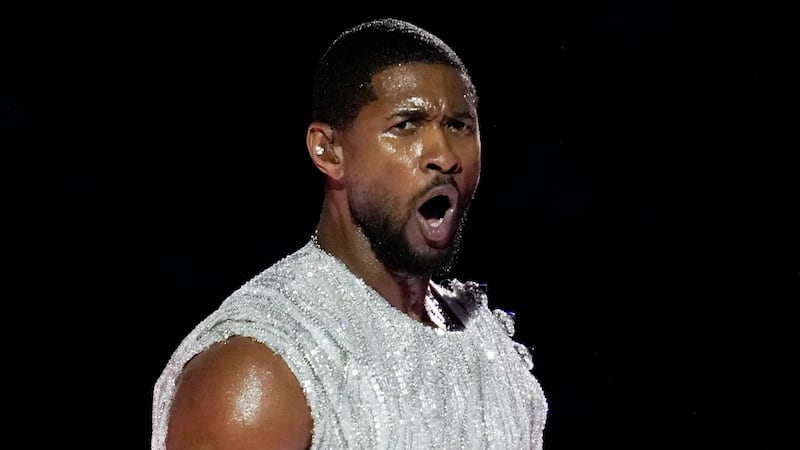 Usher performs during halftime of the NFL Super Bowl 58 football game between the San...