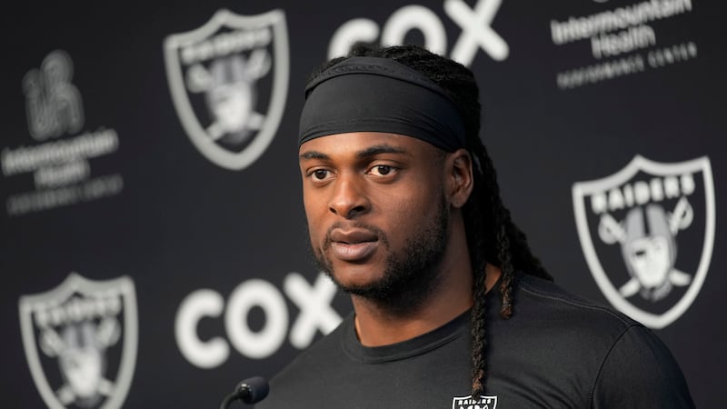 Las Vegas Raiders wide receiver Davante Adams speaks during a news conference at the NFL...