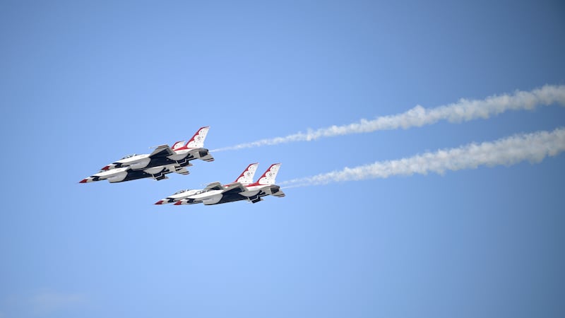 Members of the United States Air Force Thunderbirds perform over Daytona International...