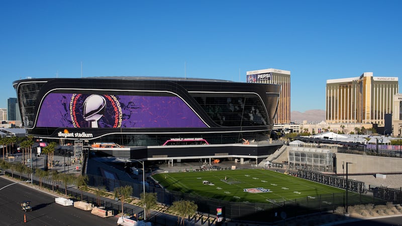 Workers prepare Allegiant Stadium ahead of the Super Bowl, Tuesday, Jan. 30, 2024, in Las...