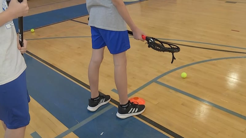 The Las Vegas Desert Dogs visited Burkholder Middle School to gift students lacrosse gear and...