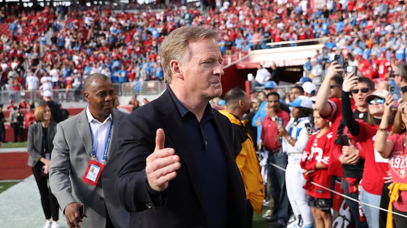 NFL Commissioner Roger Goodell gestures toward fans before the NFC Championship NFL football...