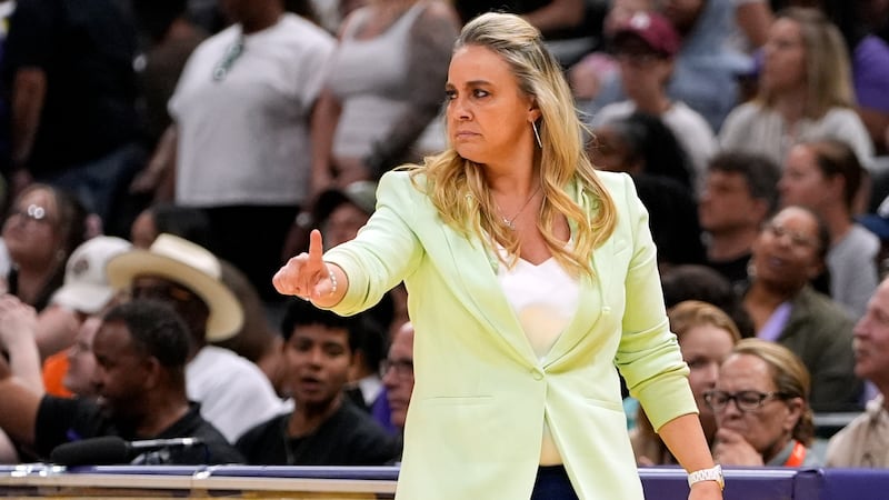 FILE - Las Vegas Aces head coach Becky Hammon gestures during the first half of a WNBA...