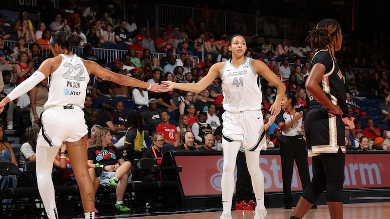 A'ja Wilson and Kiah Stokes high-five during the game against the Washington Mystics on June...