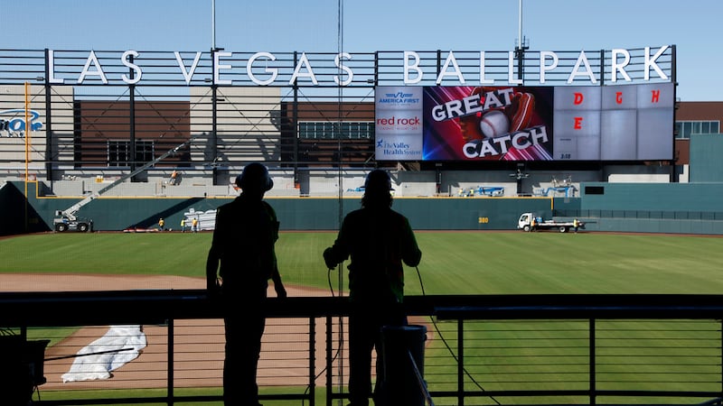 FILE - Workers continue construction on a new baseball park in Las Vegas on March 28, 2019....