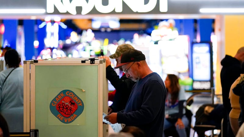 People vote at a polling station in a mall Tuesday, Nov. 8, 2022, in Las Vegas. (AP...