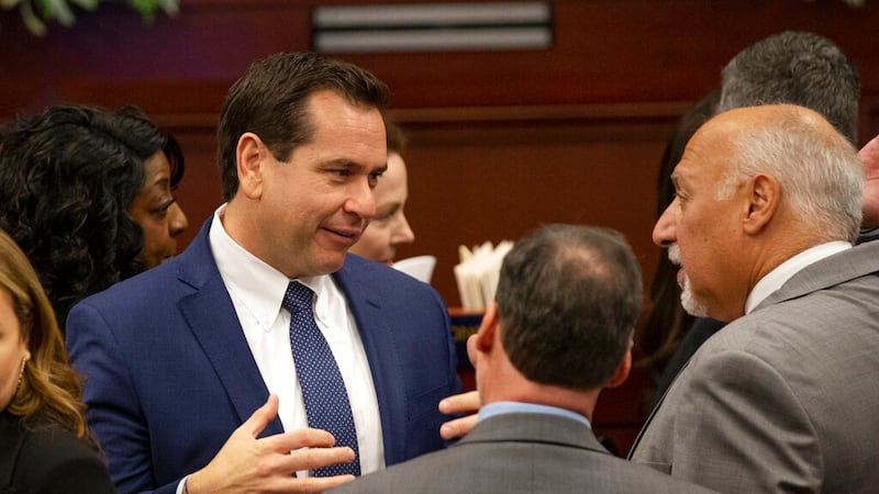 FILE - Nevada Secretary of State Cisco Aguilar, left, talks with Lt. Gov. Stavros Anthony...